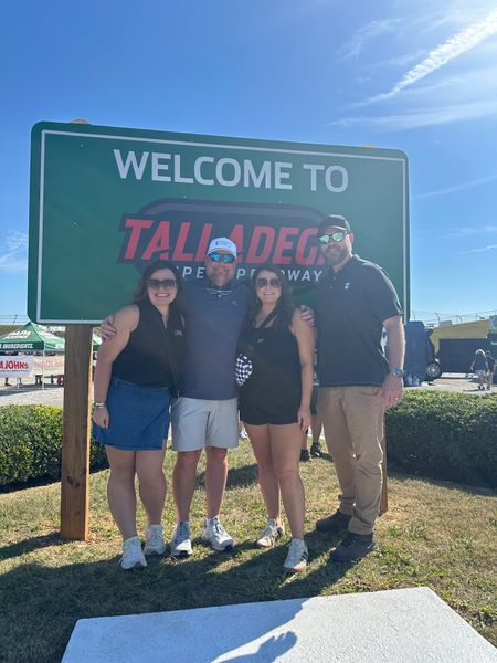 Four people together at Talladega Superspeedway